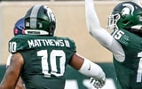 Michigan State's Angelo Grose, center celebrates his interception against Florida Atlantic with teammates Wayne Matthews III, left, and Nikai Martinez during the second quarter - Nick King, USA TODAY Sports