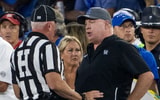 Kentucky Wildcats head coach Mark Stoops talks to a referee after a play against the Georgia Bulldogs at Kroger Field. Mandatory Credit: Tanner Pearson-Imagn Images