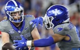 Kentucky QB Brock Vandagriff hands the ball off to Demie Sumo-Karngbaye