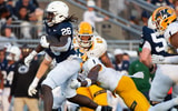 Penn State running back Cam Wallace (26) breaks off a run for a first-down in the second half of an NCAA football game against Kent State, Saturday, Sept. 21, 2024, in State College, Pa. (Dan Rainville/USA Today)