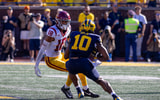 USC linebacker Eric Gentry lines up a tackle against Michigan quarterback Alex Orji