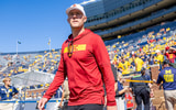 USC head coach Lincoln Riley walks onto the field at Michigan State ahead of a game between the Trojans and Wolverines