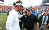Lane Kiffin congratulates Mark Stoops after a Kentucky win