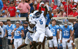 Kentucky CB DJ Waller breaks up a pass to Ole Miss WR Juice Wells