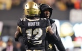 Travis Hunter and Deion Sanders by Ron Chenoy-Imagn Images