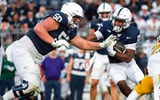 Penn State offensive lineman Cooper Cousins (50) blocks for running back Quinton Martin Jr. (26) in the second half of an NCAA football game against Kent State, Saturday, Sept. 21, 2024, in State College, Pa. (© Dan Rainville / USA TODAY NETWORK via Imagn Images)