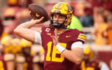 Minnesota Golden Gophers quarterback Max Brosmer (16) warms up before the game against the USC Trojans at Huntington Bank Stadium