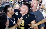 Vanderbilt Commodores quarterback Diego Pavia celebrates with fans after defeating the Alabama Crimson Tide at FirstBank Stadium. Mandatory Credit: Butch Dill-Imagn Images