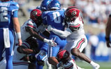 Bangally Kamara and other South Carolina defenders tackle a Kentucky back (Photo: CJ Driggers | GamecockCentral.com)