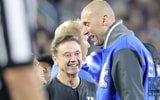 Mark Pope and Rick Pitino talk on the sideline at Kroger Field - Dr. Michael Huang, Kentucky Sports Radio