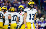 Michigan Wolverines quarterback Jack Tuttle (13) struggled against Illinois. Joe Nicholson-Imagn Images