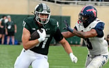 Michigan State Spartans tight end Michael Masunas (81) gets a first down against Florida Atlantic Owls linebacker Eddie Williams (3) in the first quarter at Spartan Stadium. - Dale Young, USA TODAY Sports