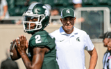 Michigan State's offensive coordinator Brian Lindgren, right, watches as Aidan Chiles warms up before the football game against Prairie View A&M on Saturday, Sept. 14, 2024, at Spartan Stadium - Nick King, USA TODAY Sports