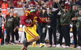 USC receiver Makai Lemon runs for a touchdown during a game against the Rutgers Scarlet Knights