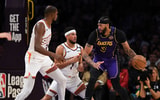 Devin Booker defending Anthony Davis - Jonathan Hui, Imagn Images