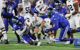 Kentucky defenders tackling Auburn player - Dr. Michael Huang, Kentucky Sports Radio