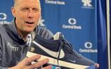 Mark Pope holding Devin Booker's signature shoe, the Book 1 - Dylan Ballard, A Sea Of Blue