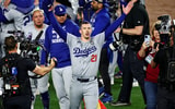 Oct 30, 2024; New York, USA, LAD; Los Angeles Dodgers pitcher Walker Buehler (21) celebrates after the Los Angeles Dodgers beat the New York Yankees in game four to win the 2024 MLB World Series at New York. Mandatory Credit: Wendell Cruz-MLB