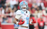Nov 2, 2024; Fayetteville, Arkansas, USA; Ole Miss Rebels wide receiver Jordan Watkins (11) runs for a touchdown after a catch in the fourth quarter against the Arkansas Razorbacks at Donald W. Reynolds Razorback Stadium. Mississippi won 63-31. Mandatory Credit: Nelson Chenault-Imagn Images
