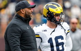 Michigan head coach Sherrone Moore (left) and quarterback Davis Warren (right) talk before the 2024 spring game. (Junfu Han / USA TODAY NETWORK)