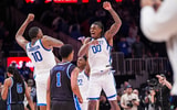 Kentucky C Brandon Garrison and Otega Oweh celebrate a win over Duke