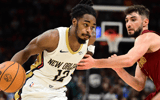 Antonio Reeves drives to the bucket for the Pelicans, via Imagn Images