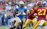 UCLA Bruins running back TJ Harden (25) runs during the first quarter against the USC Trojans at United Airlines Field at Los Angeles Memorial Coliseum