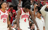 Ohio State Buckeyes forward Devin Royal (21), forward Aaron Bradshaw (4) and assistant coach Luke Simons react to a shot by center Ivan Njegovan during the second half of the NCAA men's basketball game against the Evansville Purple Aces at Value City Arena in Columbus on Tuesday, Nov. 19, 2024. Ohio State won 80-30.  (Adam Cairns/Columbus Dispatch / USA TODAY NETWORK via Imagn Images)