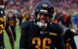 Dec 1, 2024; Landover, Maryland, USA; Washington Commanders running back Chris Rodriguez Jr. (36) celebrates with teammates after scoring a touchdown against the Tennessee Titans during the fourth quarter at Northwest Stadium. Mandatory Credit: Geoff Burke-Imagn Images