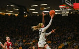 Iowa guard Lucy Olsen makes a layup against Washington State. (Photo by Dennis Scheidt)