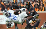 Kentucky tight end Khamari Anderson (15) is tackled by Tennessee defensive back Christian Harrison (5), during a game between Tennessee and Kentucky at Neyland Stadium in Knoxville, Tenn., Saturday, Nov. 2, 2024. (© Caitie McMekin/News Sentinel / USA TODAY NETWORK via Imagn Images)