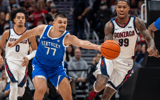 Dec 7, 2024; Seattle, Washington, USA; Kentucky Wildcats guard Kerr Kriisa (77) knocks the ball away from Gonzaga Bulldogs guard Khalif Battle (99) during the first half at Climate Pledge Arena. Mandatory Credit: Stephen Brashear-Imagn Images