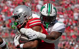 Sept. 21, 2024; Columbus, Ohio, USA; Ohio State Buckeyes running back Quinshon Judkins (1) is tackled by Marshall Thundering Herd linebacker Landyn Watson (9) during the first half of an NCAA Division I football game at Ohio Stadium on Saturday.