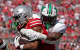 Sept. 21, 2024; Columbus, Ohio, USA; Ohio State Buckeyes running back Quinshon Judkins (1) is tackled by Marshall Thundering Herd linebacker Landyn Watson (9) during the first half of an NCAA Division I football game at Ohio Stadium on Saturday.