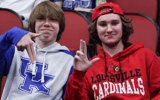 A Kentucky and Louisville fan pose at a game -  Dr. Michael Huang, Kentucky Sports Radio