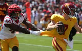 Apr 15, 2023; Los Angeles, CA, USA; USC Trojans linebacker Sam Greene (44) holds a shirt of quarterback Miller Moss (7) during the Spring Game at Los Angeles Memorial Coliseum. Mandatory Credit: Kiyoshi Mio-Imagn Images