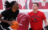 Jul 9, 2024; Columbus, OH, USA; Ohio State Buckeyes head coach Jake Diebler uses pads to defend forward Aaron Bradshaw during a summer workout in the practice gym at the Schottenstein Center. (© Adam Cairns/Columbus Dispatch / USA TODAY NETWORK)