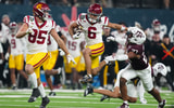 USC Trojans wide receiver Makai Lemon (6) carries the ball against Texas A&M Aggies linebacker Daymion Sanford (27) in the second half at Allegiant Stadium