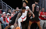 Dec 28, 2024; Louisville, Kentucky, USA;  Eastern Kentucky Colonels guard George Kimble III (left) dribbles the ball against Louisville Cardinals guard Chucky Hepburn (middle) during the second half at KFC Yum! Center. Louisville won 78-76. Mandatory Credit: Jamie Rhodes-Imagn Images
