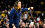 Penn State head coach Carolyn Kieger calls out instructions during a game against Iowa. (Photo by HawkCentral)