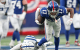 Dec 29, 2024; East Rutherford, New Jersey, USA; New York Giants wide receiver Wan'Dale Robinson (17) breaks a tackle by Indianapolis Colts safety Julian Blackmon (32) during the second half at MetLife Stadium. Mandatory Credit: Vincent Carchietta-Imagn Images