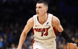 Dec 21, 2024; Orlando, Florida, USA; Miami Heat guard Tyler Herro (14) drives to the basket against the Orlando Magic in the second quarter at Kia Center. Mandatory Credit: Nathan Ray Seebeck-Imagn Images