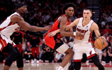 Miami Heat guard Tyler Herro (14) handles the ball against Houston Rockets guard Amen Thompson (1) during the fourth quarter at Toyota Center - Erik Williams, Imagn Images