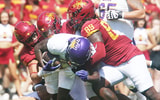 Iowa State Cyclones defensive line Tyler Onyedim (11), defensive end Trent Jones II (89), defensive back Jeremiah Cooper (4), and linebacker Carson Willich (14) take down Northern Iowa Panthers running back Tye Edwards (2) during the first quarter in the season-opening game at Jack Trice Stadium on Saturday, Sept. 2, 2023, in Ames, Iowa.