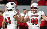 Louisville punter Brady Hodges with Brock Travelsted, via Rob Kinnan, Imagn Images