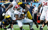 Dec 31, 2024; Tampa, FL, USA; Michigan Wolverines defensive end Derrick Moore (8) sacks Alabama Crimson Tide quarterback Jalen Milroe (4) during the first half at Raymond James Stadium. Mandatory Credit: Matt Pendleton-Imagn Images
