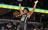Dec 21, 2024; Memphis, Tennessee, USA; Mississippi State Bulldogs guard Josh Hubbard (12) reacts after a dunk during the second half against the Memphis Tigers at FedExForum. Mandatory Credit: Wesley Hale-Imagn Images