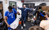 Kentucky players and Mark Pope spray water on Jaxson Robinson after the win at Mississippi State - Chet White, UK Athletics
