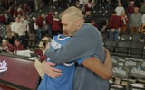 Mark Pope celebrates with Jaxson Robinson