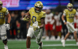 Sep 1, 2023; Atlanta, Georgia, USA; Georgia Tech Yellow Jackets running back Trey Cooley (0) runs the ball for a touchdown against the Louisville Cardinals in the second quarter at Mercedes-Benz Stadium. Mandatory Credit: Brett Davis-Imagn Images